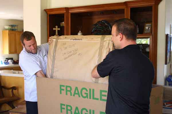 Crew_Packing_Fragile_Box_when_moving_TV