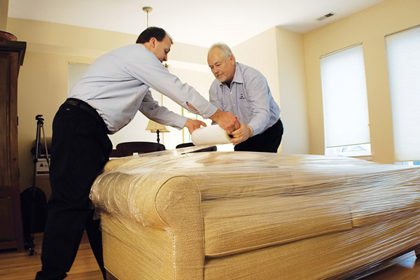 Shrink wrapping furniture prior to moving.